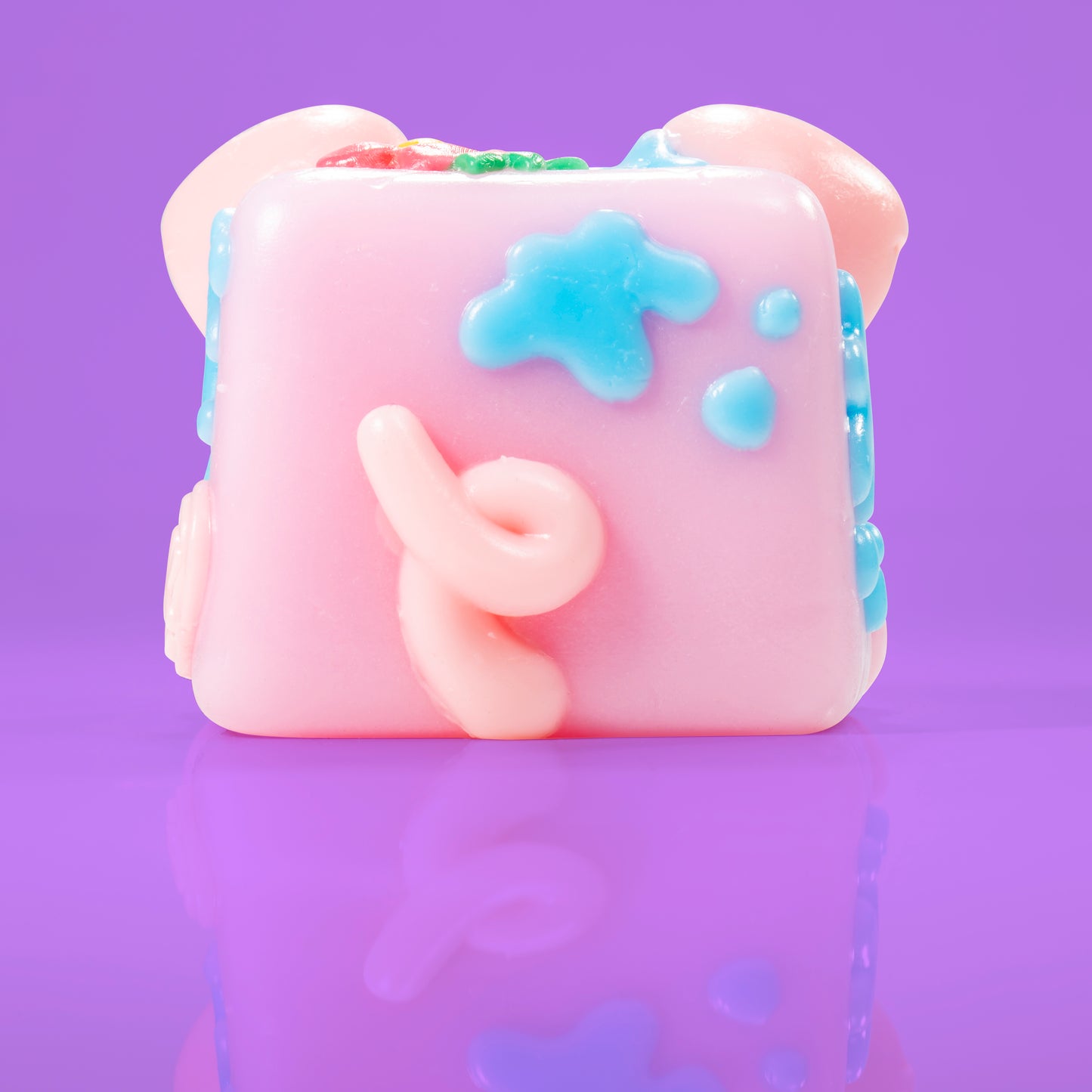Bubbles th epig Mushykinz taba squishy back view on a purple background