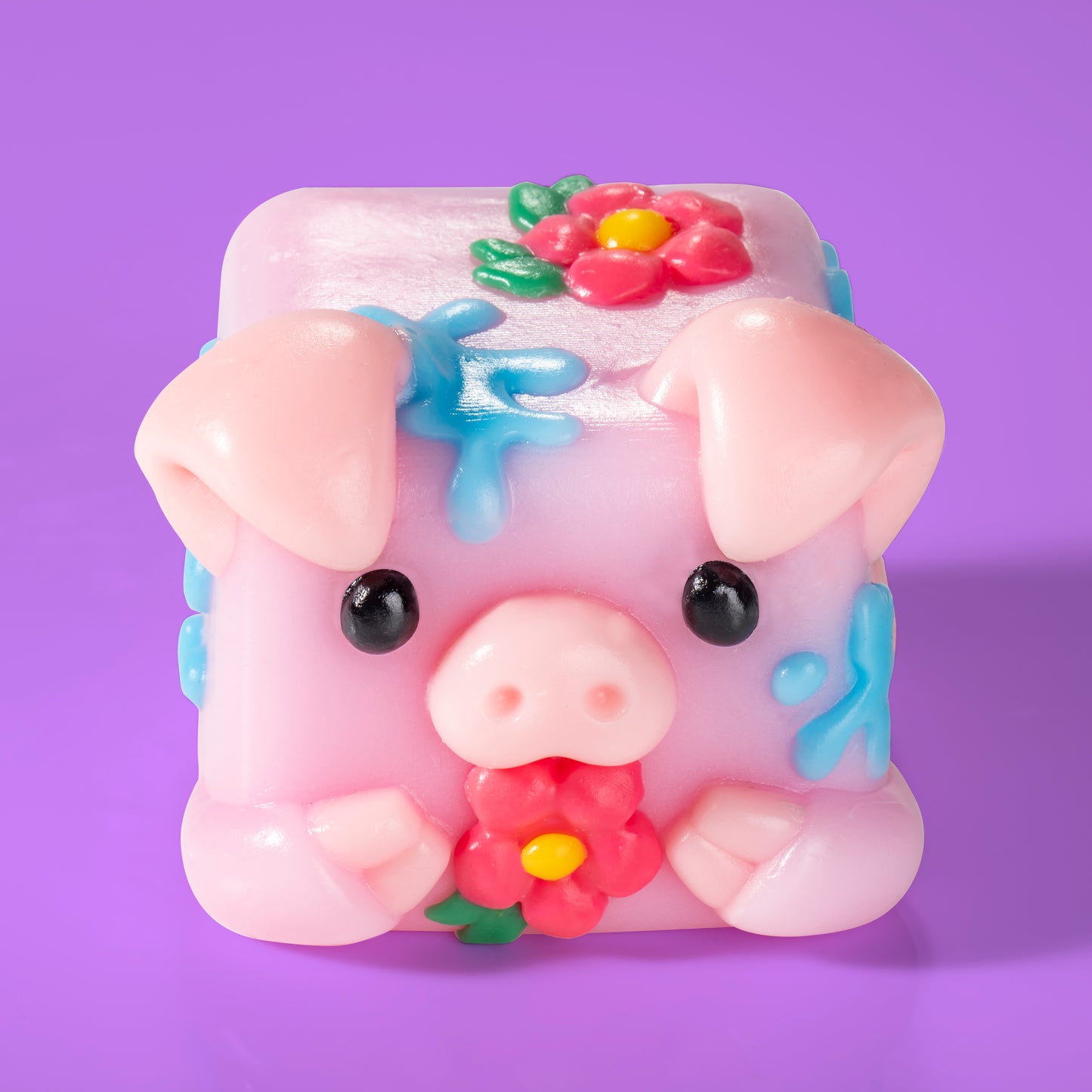 Bubbles the pig Mushykinz taba squishy top front view on a purple background