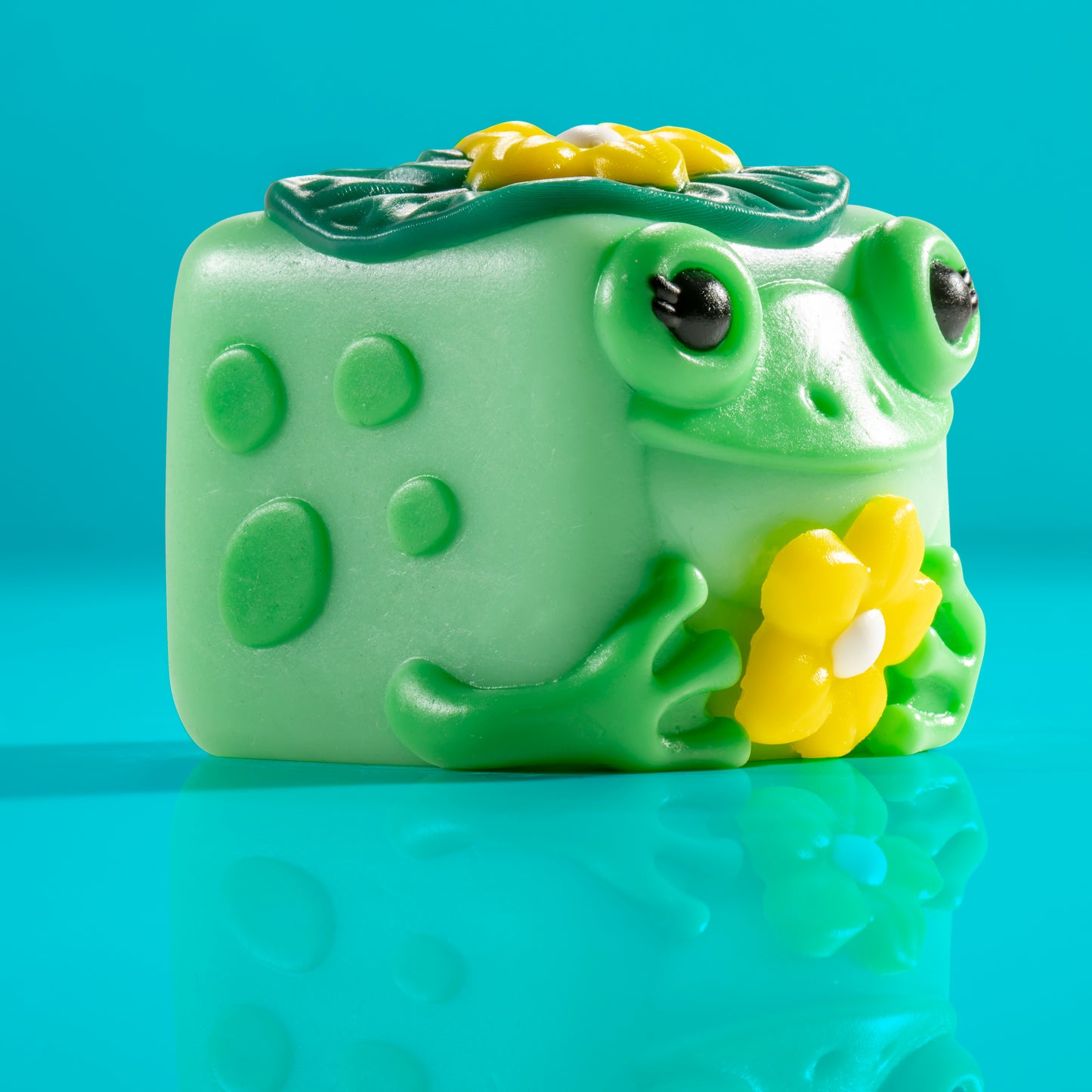 Lily the frog Mushykinz taba squishy right side view on a blue background