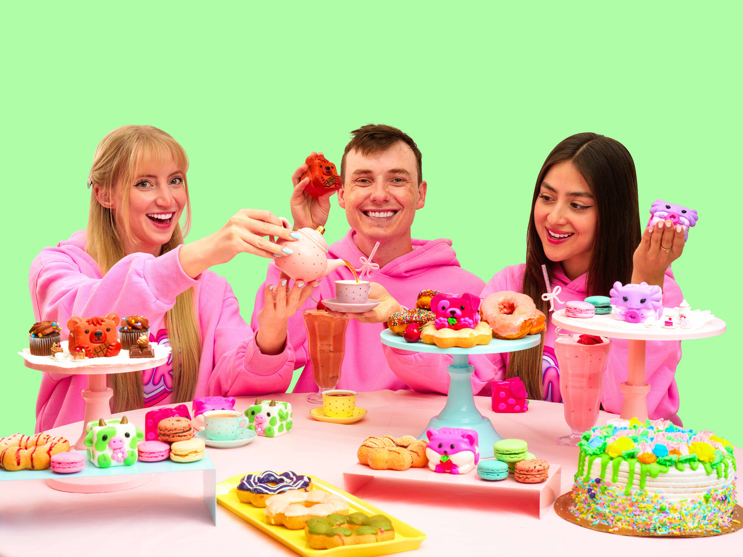 Erin, Christian, and Anna showing their Mushykinz taba squishies while having a tea party