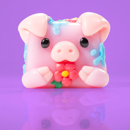 Bubbles the pig Mushykinz taba squishy front view on a purple background
