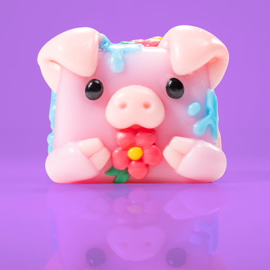 Bubbles the pig Mushykinz taba squishy front view on a purple background