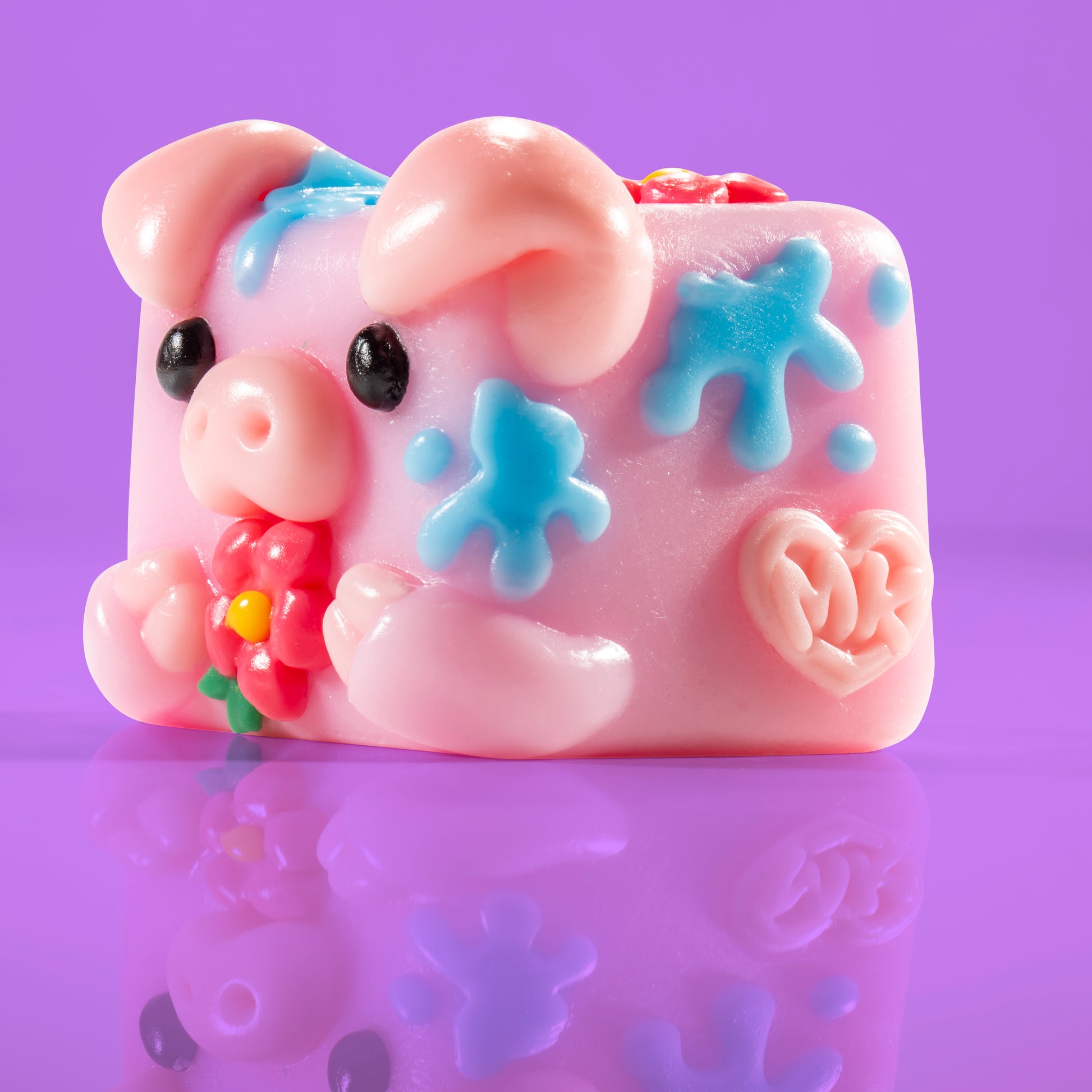 Bubbles the pig Mushykinz taba squishy left side view on a purple background